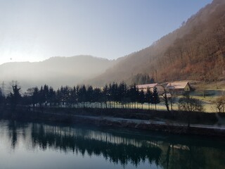 Beautiful morning landscape by the river.  Reflection of the forest on to the lake. Picture was taken in Zidani Most Slovenia.