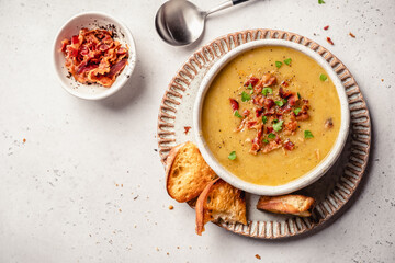 Lentil pea soup garnish with bacon and pork ribs