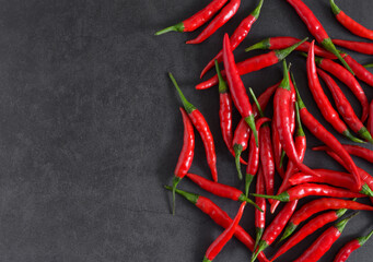 Fresh chillies (Red chilli) on a black background,Top view,copy space.