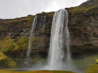 Waterfall in Iceland. Seljalandsfoss waterfall in Iceland in cloudy weather. Picture was taken on 13th of October 2019.