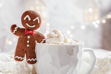 Gingerbread cookie man with a hot chocolate for Christmas holiday