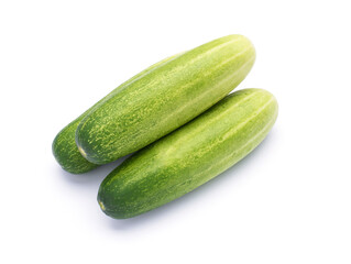 Fresh organic cucumbers from the garden Three cucumbers stacked on a white background