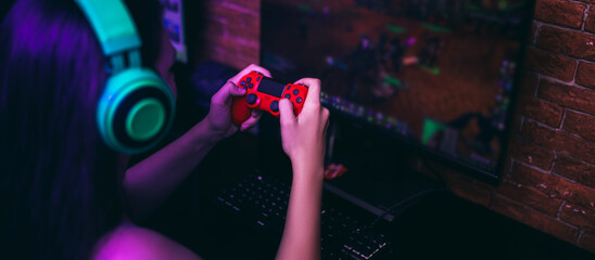 Computer games, playing place, young gamer playing video games with headphones © Anastassiya 