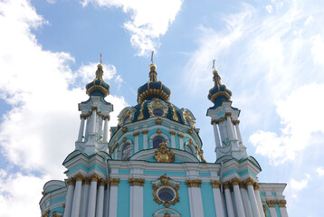 Fototapeta na wymiar The old beautiful St. Andrew's Church. Blue walls and golden domes. Kiev, Ukraine 