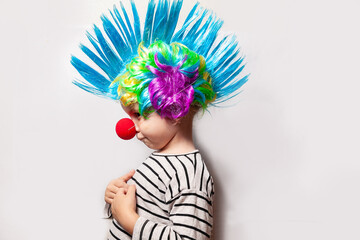 girl in clown costume with red nose