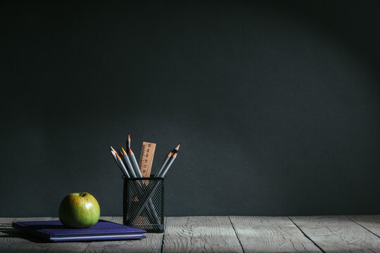 Back to school concept. stationery with fruit on the table