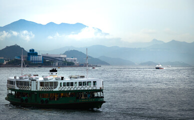 The boat is called star ferry. In hong kong, many people take it to travel between kowloon and hong kong island.