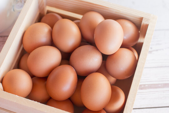 collected eggs in the basket. Egg product in a box agriculture
