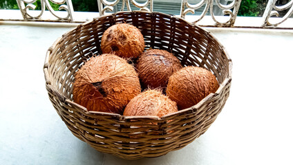 Indian fresh coconut in the basket for selling.