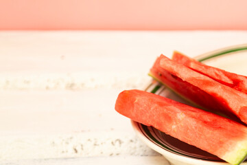 Delicious red with sliced fruit on a plate. Copy space. Summer food concept.
