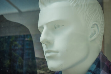 male head of mannequin white faces closeup portrait head shot on street