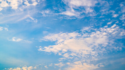 Naklejka na ściany i meble Blue summer sky with soft clouds as a background