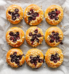 Blueberry yeast sweet rolls with the addition butter crumble top view. Traditional kolaches