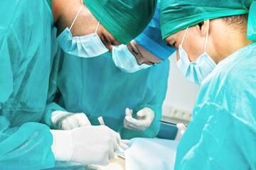 Doctors Operating on Patient