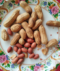 Peanut isolated in flower pattern plate.
