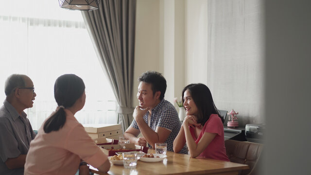 Asian Big Family Having Small Party, Dinner Food Together At Home.