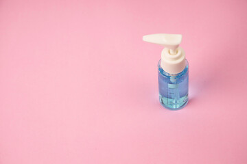 Hand sanitizer alcohol gel bottle pump rub clean hands hygiene prevention of virus , , Isolated on pink background