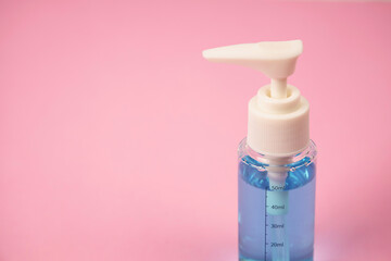 Hand sanitizer alcohol gel bottle pump rub clean hands hygiene prevention of virus , , Isolated on pink background