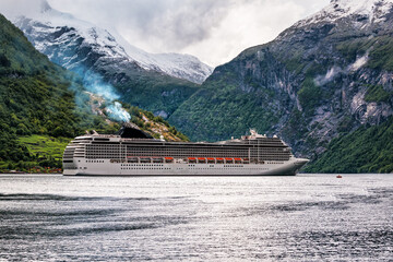 big cruise liner enters the fjord