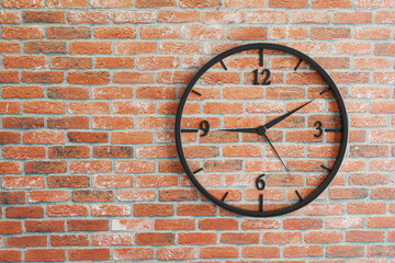 Isolated watch on rustic red brick wall background. Time measureing concept.