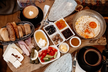 Traditional Turkish rich breakfast. A typical breakfast consists of cheese, butter, olives, eggs, tomatoes, cucumbers, jam, honey