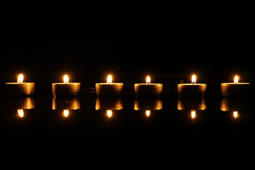 Candles on a glass desk