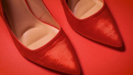 beautiful red high heel shoes on a minimalist background