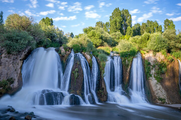 Fototapeta premium Muradiye waterfall, which is located on the Van - Dogubeyazit highway, a natural wonder often visited by tourists in Van, Turkey
