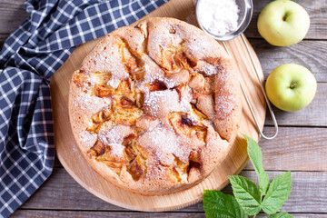 Apple pie, sponge cake, Charlotte with apples on a wooden table. Rustic style. Top view