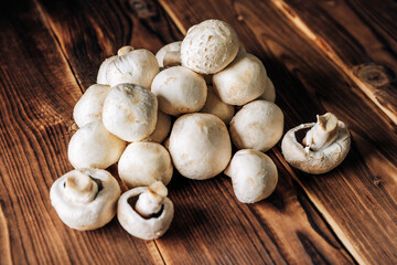 Fototapeta na wymiar Mushrooms on a wooden background close up