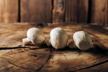 Mushrooms on a wooden background close up