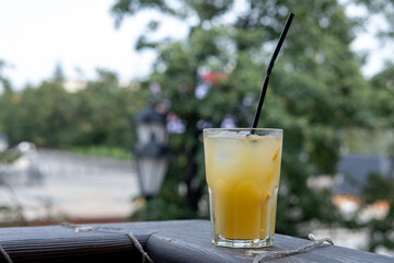 Refreshing orange drink with ice. Bar drinks.