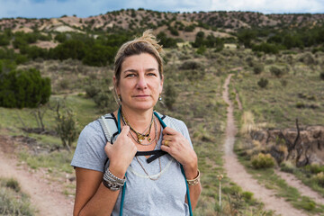 portrait of 50 year old woman hiker on nature trail