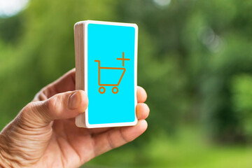 A man holds a deck of cards in his hand