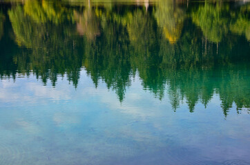 Closeup of emerald green glacier water in lakes Laghi di Fusine (Weissenfelser Seen) in Northern...