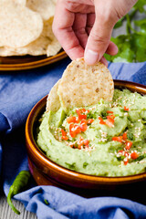 Cilantro White Bean Avocado Dip with Pepper Garnishing for Chips in Brown Bowl-chips