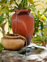 Decorative fountain with a two jugs. .