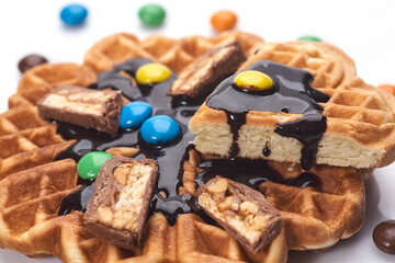 Freshly baked waffles with chocolate isolated on white background