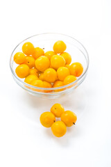 yellow cherry plums on the white background