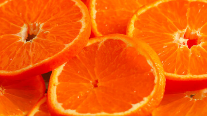 Juicy tangerine, cut into rings close-up. Background of ripe citrus fruits .