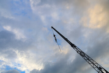 construction crane on cloudy sky industrial hoisting lift