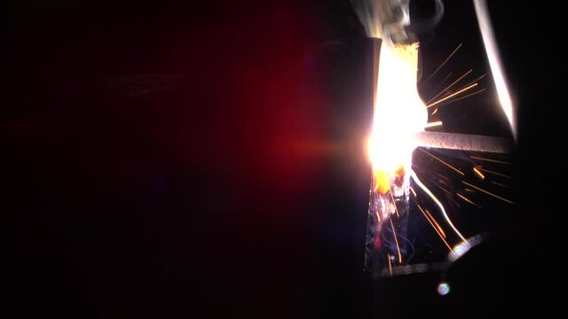Welder uses stick to complete a vertical pass.
