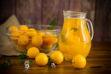 sweet cooked compote in a glass decanter of ripe yellow cherry plum
