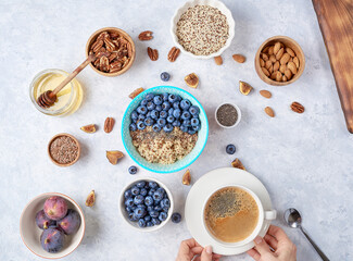 Healthy breakfast of superfoods, quinoa, honey, nuts, figs, coffee. Top view