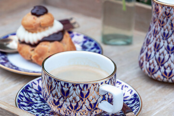 Close up of Benjarong Thai porcelain handicraft product in a shape of cup of tea or coffee.  