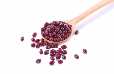 Red beans in spoon on white background