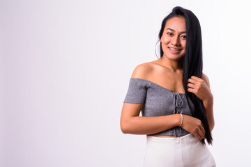 Obraz premium Portrait of happy young beautiful Asian woman with braces