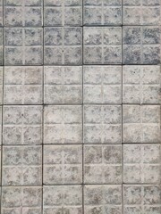 Square pavement textured tiles gray and dark colour stone material