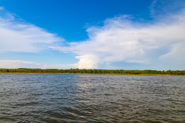 A view of the distant shoreline across the South Saskatchewan River