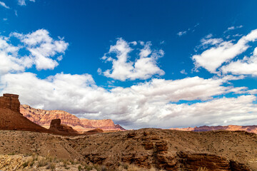 Wide open blue skies, white clouds and rugged landscape near Navajo bridge, AZ, USA